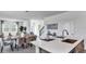 Open concept living and dining area with modern finishes and plenty of natural light at 606 Terrapin Dr, Debary, FL 32713