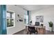 Office space with natural light, wood floors, and modern decor at 606 Terrapin Dr, Debary, FL 32713