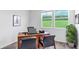 Office space with a large window, neutral walls, and plush carpeting at 606 Terrapin Dr, Debary, FL 32713