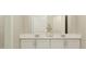 Bright bathroom with dual sinks, modern fixtures, and quartz countertops at 7244 Summer Ivy Aly, Orlando, FL 32829