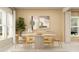 Elegant dining room featuring modern decor, neutral walls, and natural lighting at 7244 Summer Ivy Aly, Orlando, FL 32829