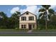 Charming two-story home with well-maintained landscaping and tropical palm trees at 7244 Summer Ivy Aly, Orlando, FL 32829