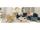 Comfortable living room showcasing a blue sectional sofa and stylish decor at 7244 Summer Ivy Aly, Orlando, FL 32829