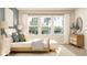 Bright main bedroom with lots of natural light, light wood furniture, neutral walls, and white linens at 7244 Summer Ivy Aly, Orlando, FL 32829