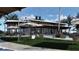Clubhouse by the pool with covered seating, lounge chairs, and well-manicured lawn areas at 7244 Summer Ivy Aly, Orlando, FL 32829