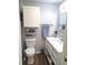 Clean bathroom features a toilet, vanity with storage, and modern fixtures for convenience at 242 Rosa Blanca, Winter Haven, FL 33884