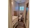Nicely updated bathroom with vanity, white cabinets, and shower, offering a clean and modern space at 242 Rosa Blanca, Winter Haven, FL 33884
