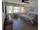 Bright bedroom with wood floors, plantation shutters, and neutral colors, creating a relaxing retreat at 242 Rosa Blanca, Winter Haven, FL 33884