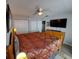 Large bedroom featuring a king bed, ceiling fan, and modern furniture including a dresser at 242 Rosa Blanca, Winter Haven, FL 33884