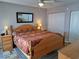 Spacious bedroom featuring a wooden bed, matching nightstands, and ample closet space at 242 Rosa Blanca, Winter Haven, FL 33884