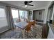 Bright dining area with a wooden table, seating for four, and access to an outdoor patio at 242 Rosa Blanca, Winter Haven, FL 33884