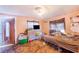 This bedroom has a double bed with 2 windows at 117 Sw 3Rd Ave, Mulberry, FL 33860