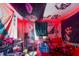 Bedroom interior with graffiti-inspired decor, posters, and a water bottle case on a bed at 117 Sw 3Rd Ave, Mulberry, FL 33860
