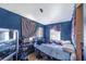 This bedroom is equipped with a double bed, mirror and small window unit at 117 Sw 3Rd Ave, Mulberry, FL 33860