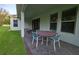 Relaxing outdoor patio with comfortable seating and a dining table at 13525 Gorgona Isle Dr, Windermere, FL 34786