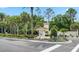 Elegant community entrance with manicured landscaping and a welcoming sign at 13525 Gorgona Isle Dr, Windermere, FL 34786