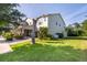 Two-story home with a well-manicured lawn and a lush, green yard at 13525 Gorgona Isle Dr, Windermere, FL 34786