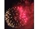 Vibrant display of red and gold fireworks lighting up the night sky at 13525 Gorgona Isle Dr, Windermere, FL 34786