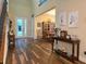 Inviting foyer boasts a soaring ceiling and beautiful wood-look tile leading into the dining area at 13525 Gorgona Isle Dr, Windermere, FL 34786