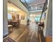 Open-concept foyer with wood floors, high ceilings, and views into the living and dining spaces at 13525 Gorgona Isle Dr, Windermere, FL 34786