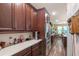 Bright kitchen with stainless steel appliances, ample counter space, and a view of the dining area at 13525 Gorgona Isle Dr, Windermere, FL 34786