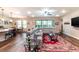 Bright living room with a large sectional couch, wood floors, and natural light at 13525 Gorgona Isle Dr, Windermere, FL 34786