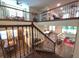 Open living spaces showcasing wood floors, ornate railings, with views to multiple living and dining areas at 13525 Gorgona Isle Dr, Windermere, FL 34786