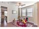 This playroom features hardwood floors, a ceiling fan, and a tea set on a table at 13525 Gorgona Isle Dr, Windermere, FL 34786