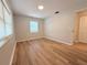 Bedroom with hardwood flooring, a window, and a closet at 1505 Piedmont Dr, Deltona, FL 32725