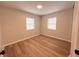 This bedroom features modern flooring and plenty of natural light at 1505 Piedmont Dr, Deltona, FL 32725