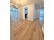 Dining room with sliding glass door and new flooring, open to kitchen at 1505 Piedmont Dr, Deltona, FL 32725