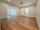 Large open living area with freshly painted walls and updated flooring at 1505 Piedmont Dr, Deltona, FL 32725