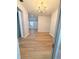 Open-concept living room with new floors and modern lighting fixtures at 1505 Piedmont Dr, Deltona, FL 32725
