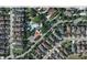 An aerial view of the neighborhood featuring lush greenery, community pool and residential homes at 11578 Ashlin Park Blvd, Windermere, FL 34786