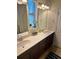Bathroom featuring double sinks, quartz countertops, and modern fixtures at 11578 Ashlin Park Blvd, Windermere, FL 34786