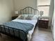 Bedroom featuring wood-look floors, a black metal bed frame and neutral decor at 11578 Ashlin Park Blvd, Windermere, FL 34786