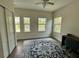 Bedroom with three windows, a ceiling fan, light walls and nice rug at 11578 Ashlin Park Blvd, Windermere, FL 34786