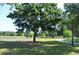 Picturesque community park featuring lush greenery, mature trees, and a tranquil lake at 11578 Ashlin Park Blvd, Windermere, FL 34786