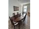 Dining room with hardwood floors and a large wooden table with 6 chairs at 11578 Ashlin Park Blvd, Windermere, FL 34786