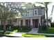 Charming two-story home featuring a welcoming front porch and well-manicured landscaping at 11578 Ashlin Park Blvd, Windermere, FL 34786