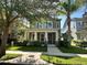 Charming two-story home featuring a welcoming front porch and well-manicured landscaping at 11578 Ashlin Park Blvd, Windermere, FL 34786