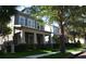 Charming two-story home featuring a welcoming front porch and well-manicured landscaping at 11578 Ashlin Park Blvd, Windermere, FL 34786