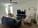 Cozy living room with a ceiling fan, comfortable seating, and natural light at 11578 Ashlin Park Blvd, Windermere, FL 34786