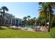 Resort style community pool with tables, chairs, and sun umbrellas at 11578 Ashlin Park Blvd, Windermere, FL 34786