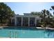 Community pool with clear blue water and community center at 11578 Ashlin Park Blvd, Windermere, FL 34786