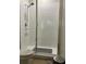Bathroom featuring a white tiled shower with glass doors at 11578 Ashlin Park Blvd, Windermere, FL 34786