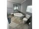 Bathroom features a corner tub with decorative tile and updated fixtures at 118 Jana Cir, Auburndale, FL 33823