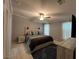 Bedroom featuring a ceiling fan, tile floors, and modern decorations at 118 Jana Cir, Auburndale, FL 33823