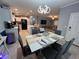 Open-concept dining area flowing into a modern kitchen and cozy living space at 118 Jana Cir, Auburndale, FL 33823