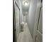 Hallway featuring wood-look floors and neutral paint at 118 Jana Cir, Auburndale, FL 33823